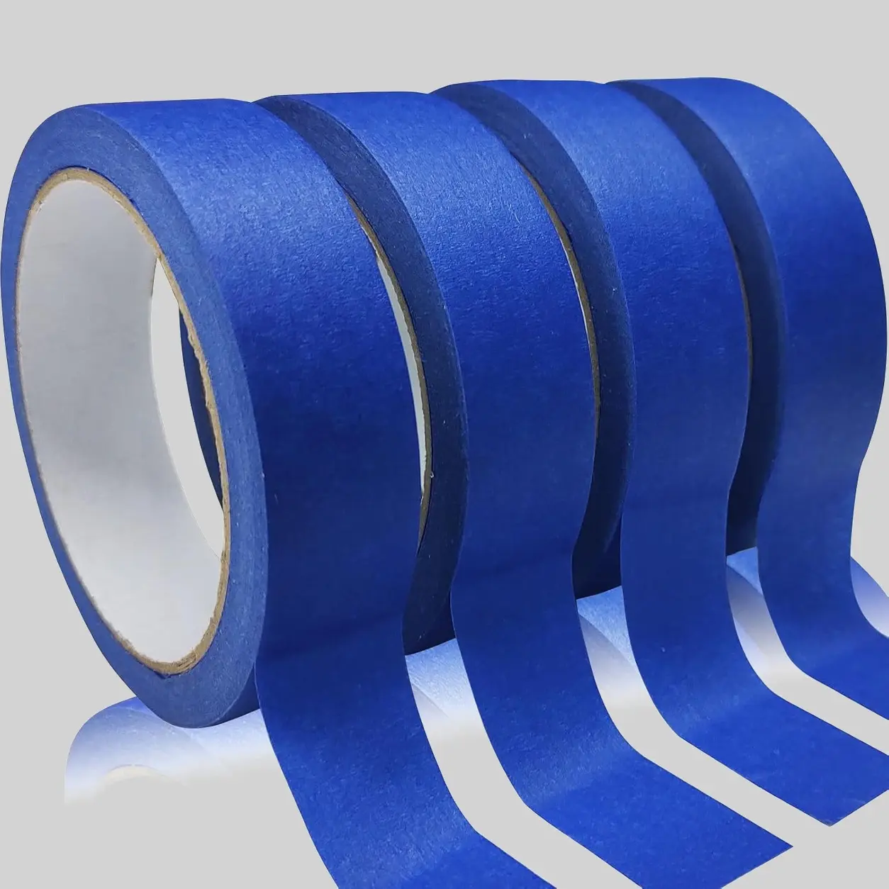 Masking tape protecting floor edges during epoxy coating